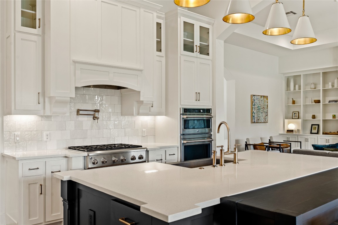 7909 Orisha Drive Austin, TX 78739 - Photo 9 of 40 a kitchen with a stove a sink and a refrigerator