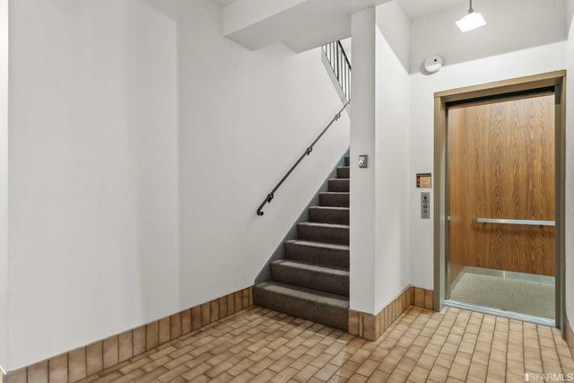 a view of entryway with stairs