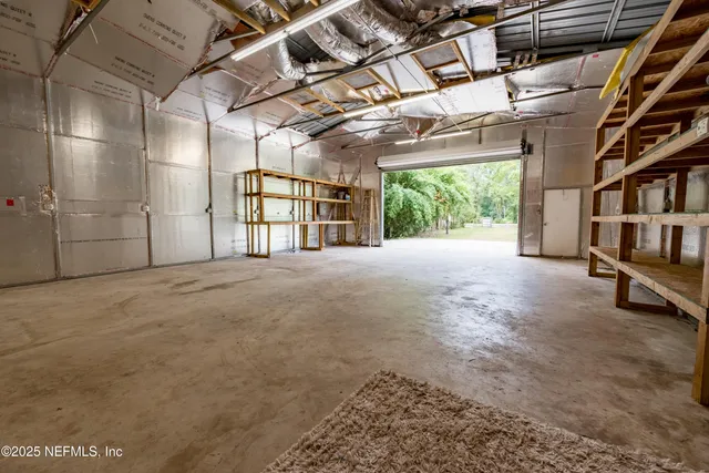 a view of an empty room with windows