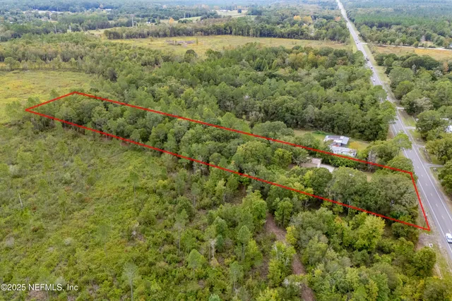 a view of a field with an trees