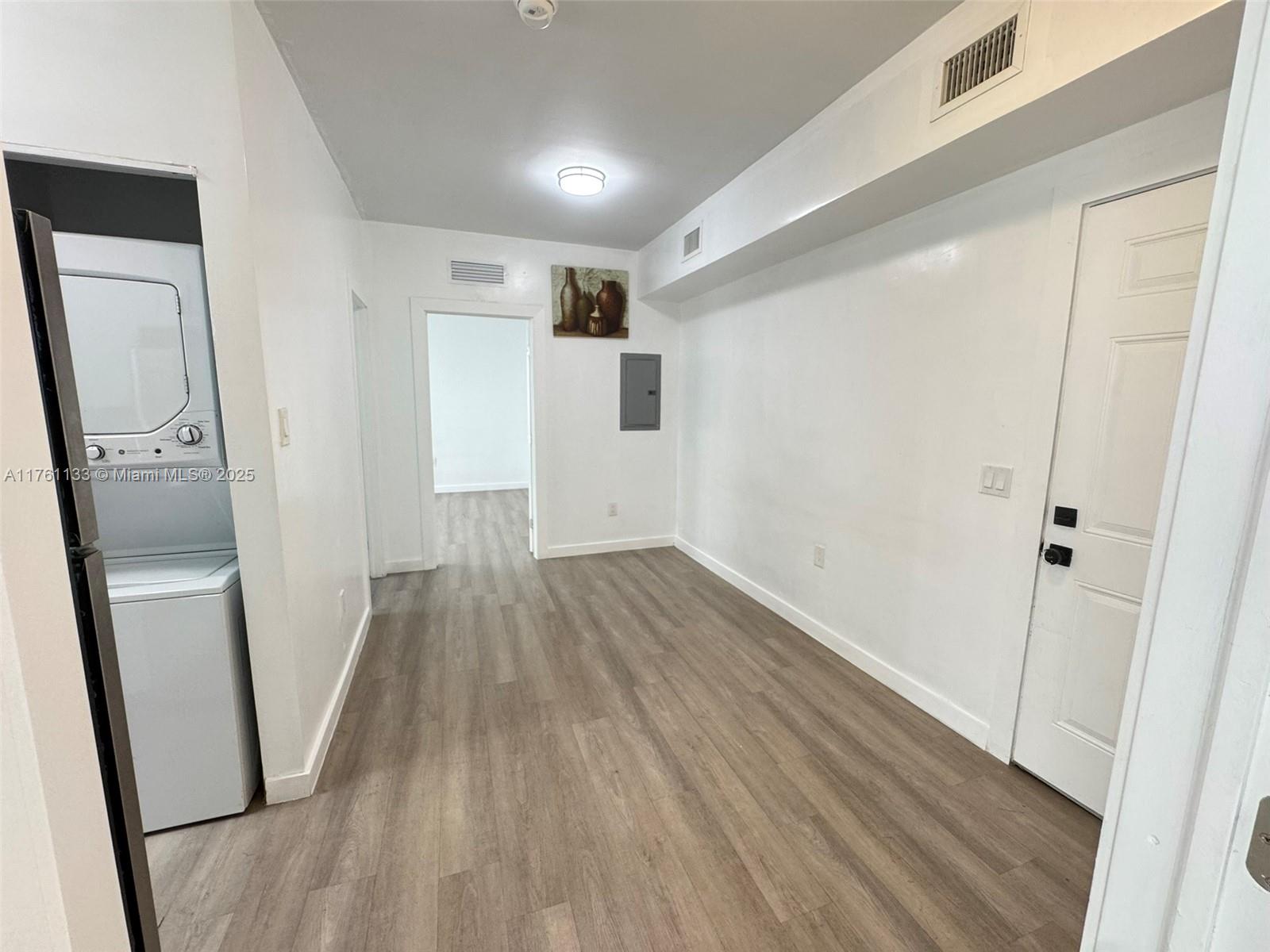 1936 Southwest 2nd Street, Unit 9 Miami, FL 33135 - Photo 3 of 14 a view of hallway with wooden floor