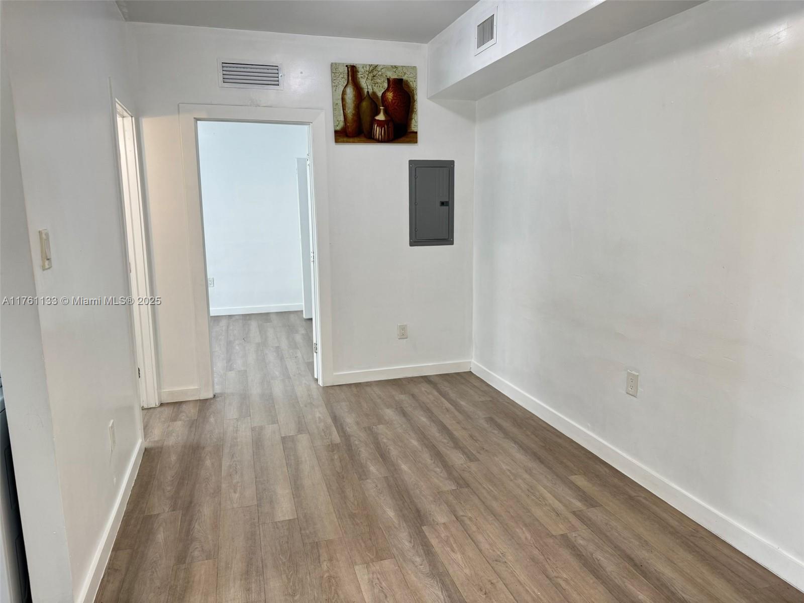 1936 Southwest 2nd Street, Unit 9 Miami, FL 33135 - Photo 6 of 14 a view of a room with wooden floor