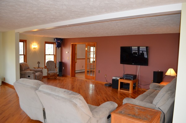 15 Bay Path Road Belchertown, MA 01007 - Photo 11 of 30 a living room with furniture and a flat screen tv