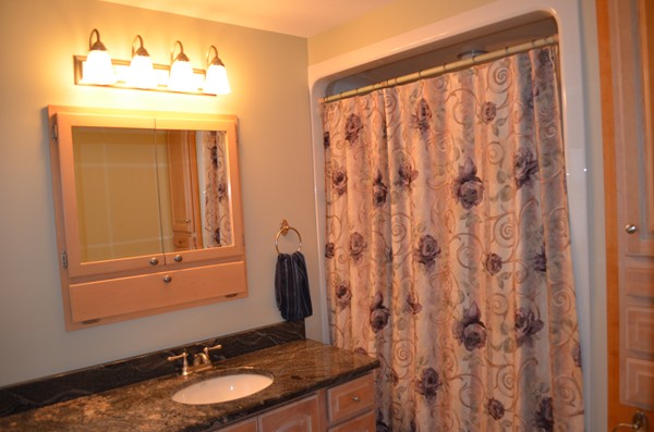 15 Bay Path Road Belchertown, MA 01007 - Photo 13 of 30 a bathroom with a granite countertop sink and a mirror