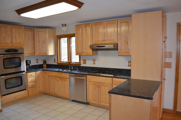15 Bay Path Road Belchertown, MA 01007 - Photo 2 of 30 a kitchen with stainless steel appliances granite countertop a sink stove and cabinets