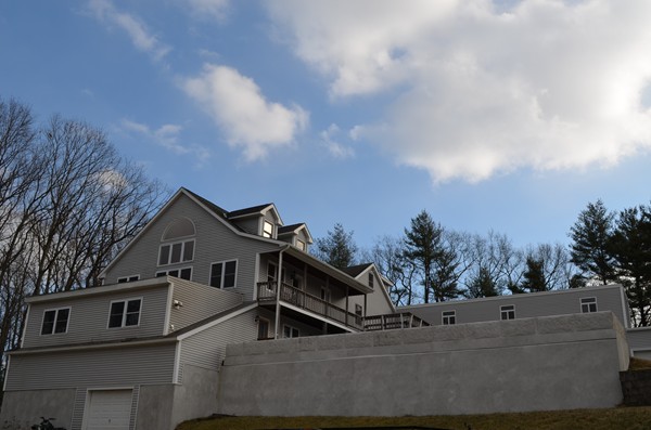15 Bay Path Road Belchertown, MA 01007 - Photo 30 of 30 a view of a white house next to a yard with large trees