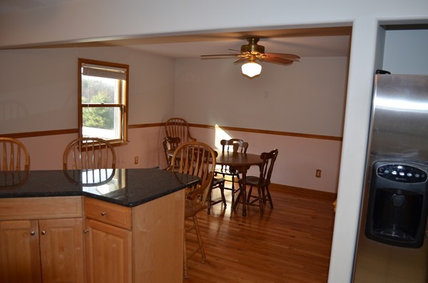 15 Bay Path Road Belchertown, MA 01007 - Photo 5 of 30 a view of a dining room with furniture and wooden floor