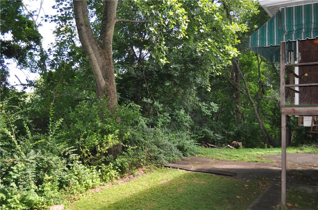 224 Johnston Road Pittsburgh, PA 15235 - Photo 22 of 23 The back of the home offers a small yard for playing. The property extends well into the treed area.
