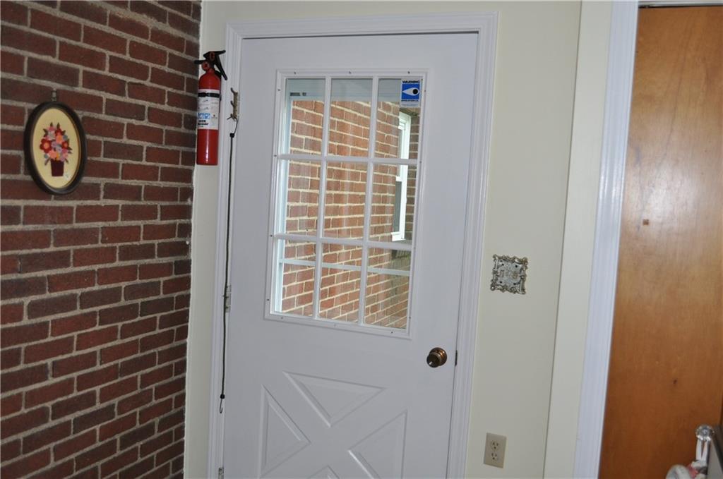 224 Johnston Road Pittsburgh, PA 15235 - Photo 7 of 23 This is the door leading out of the laundry room. Another coat closet is found here along with lots of natural light.
