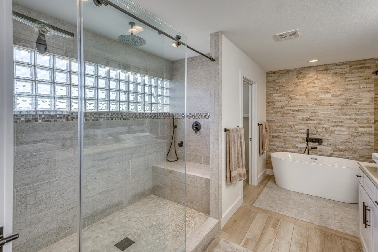3305 Close Call Horseshoe Bay, TX 78657 - Photo 15 of 30 a bathroom with a bathtub and a shower