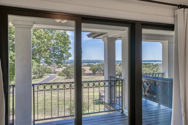 a spacious bathroom with a granite countertop sink a toilet and shower