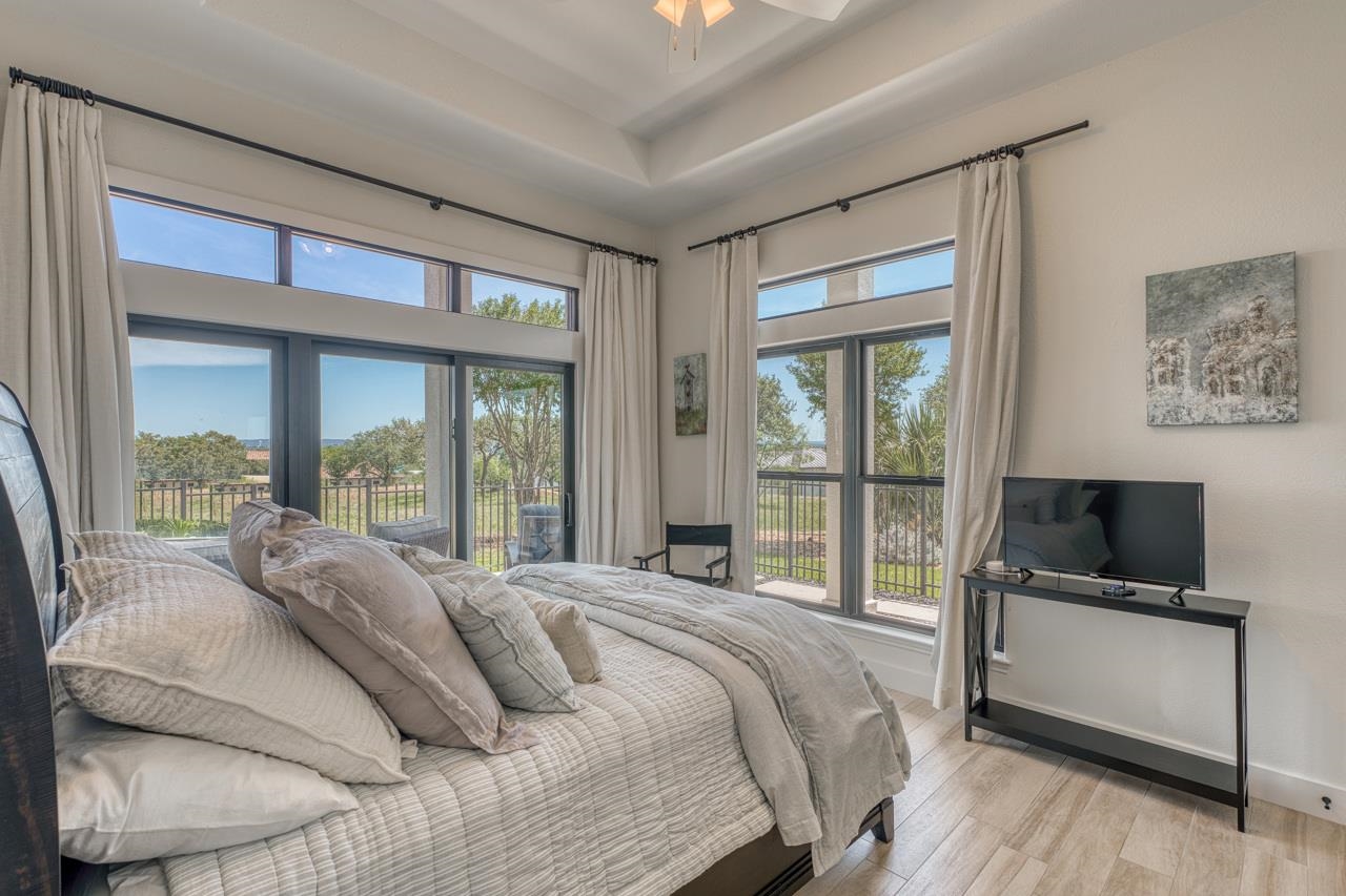 3305 Close Call Horseshoe Bay, TX 78657 - Photo 23 of 30 a bedroom with a bed and a large window