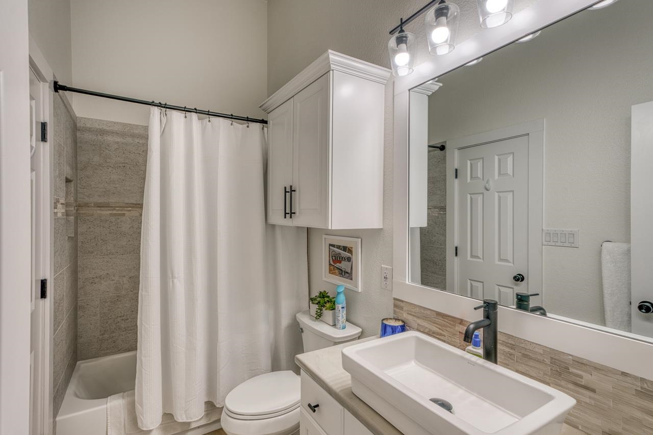 3305 Close Call Horseshoe Bay, TX 78657 - Photo 24 of 30 a bathroom with a sink toilet a mirror and shower