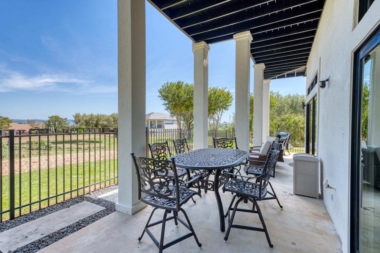 3305 Close Call Horseshoe Bay, TX 78657 - Photo 25 of 30 a view of a patio with a table chairs and a table