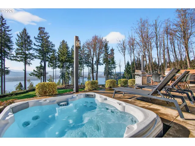 a front view of a house with a yard table and chairs