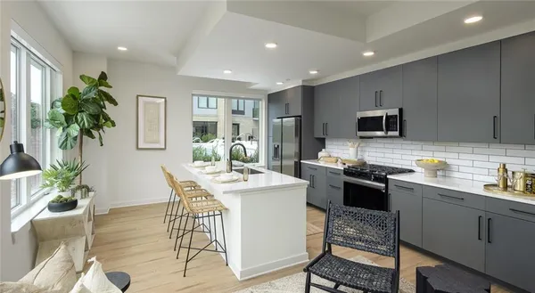 a kitchen with a table and chairs in it