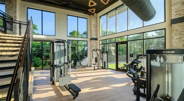 a view of a porch with furniture and floor to ceiling window
