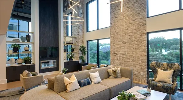 a outdoor living room with furniture and a fireplace