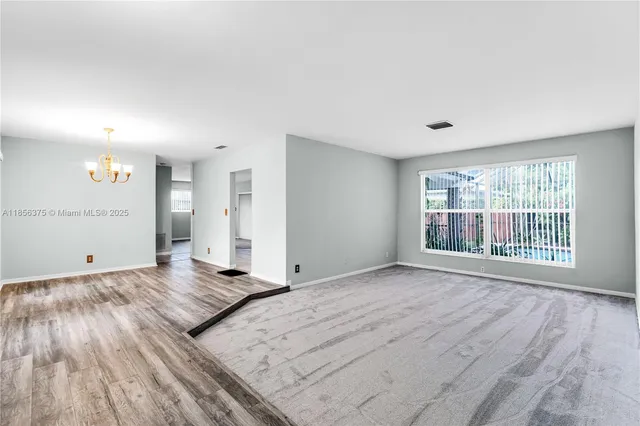 a view of an empty room and window