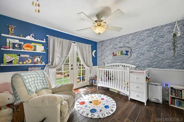 a bedroom with furniture and a wooden floor