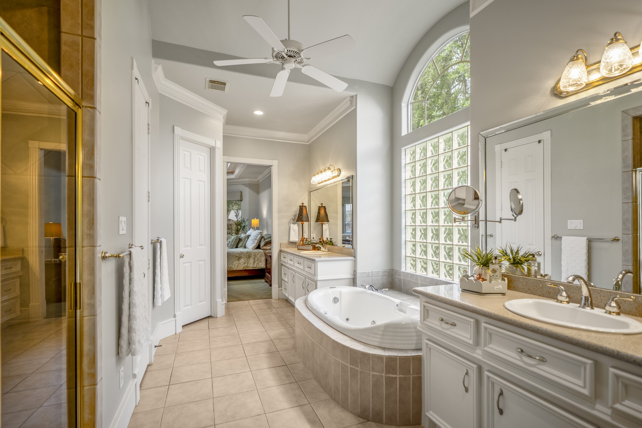 8806 Sterling Gate Circle Spring, TX 77379 - Photo 23 of 40 The primary bathroom has dual vanities, two large walk in closets, whirlpool tub and separate shower.