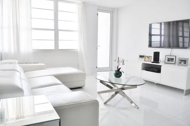 a living room with furniture and a table