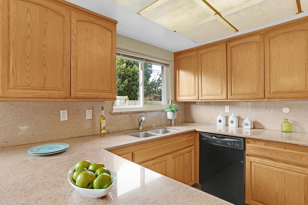 773 Crestview Drive Millbrae, CA 94030 - Photo 13 of 40 a kitchen with a sink a stove and cabinets