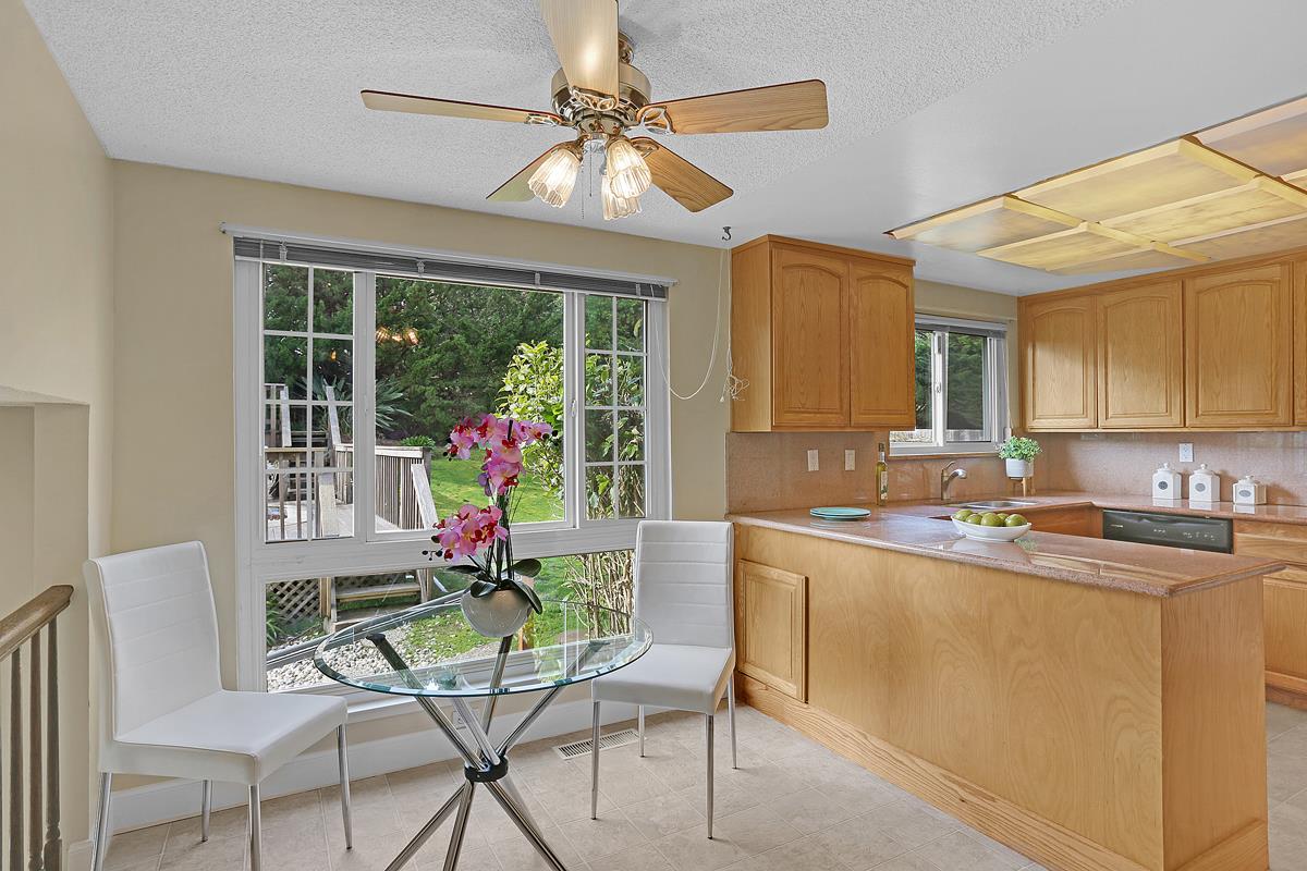 773 Crestview Drive Millbrae, CA 94030 - Photo 14 of 40 a kitchen with a table and chairs in it