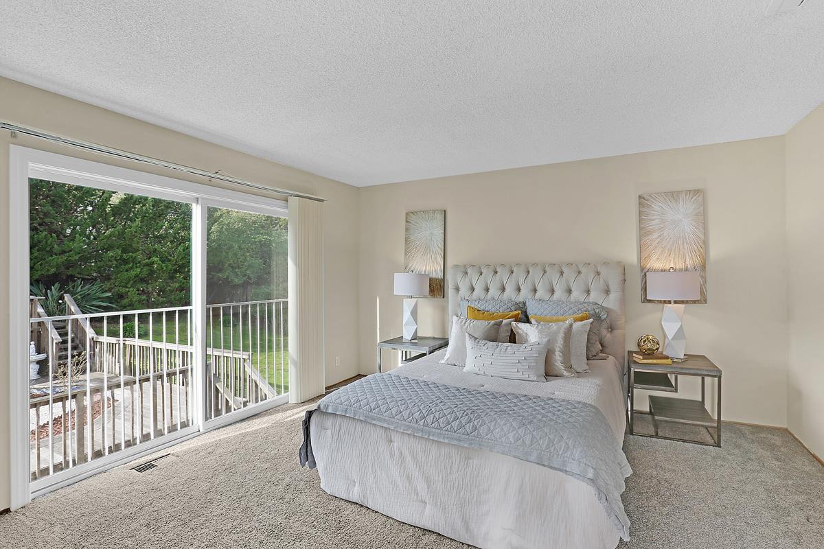 773 Crestview Drive Millbrae, CA 94030 - Photo 20 of 40 a bedroom with furniture and a large window