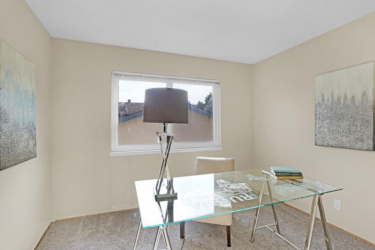 773 Crestview Drive Millbrae, CA 94030 - Photo 24 of 40 a view of a room with a furniture wooden floor and a chandelier