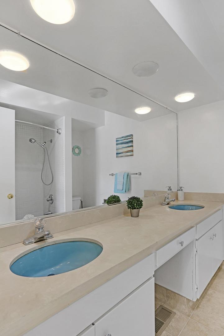 773 Crestview Drive Millbrae, CA 94030 - Photo 30 of 40 a bathroom with a double vanity sink and a mirror