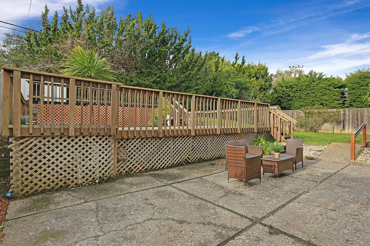 773 Crestview Drive Millbrae, CA 94030 - Photo 32 of 40 a view of a chair and table in the back yard of the house