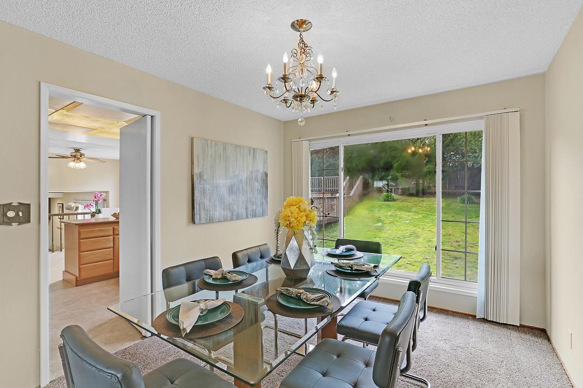 773 Crestview Drive Millbrae, CA 94030 - Photo 9 of 40 a view of a dining room with furniture wooden floor and a chandelier