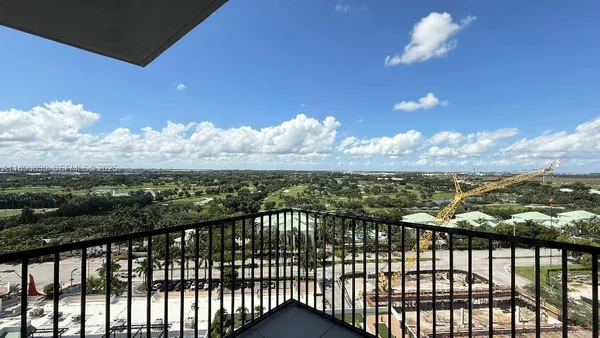 a view of a balcony with an outdoor seating
