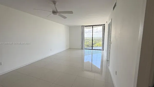a view of an empty room with a window