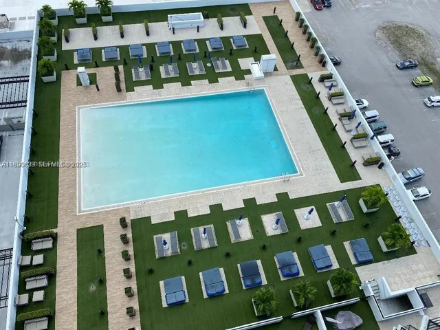 a kitchen with a sink appliances and cabinets