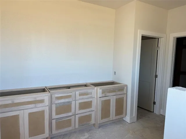 a view of an empty room with empty racks