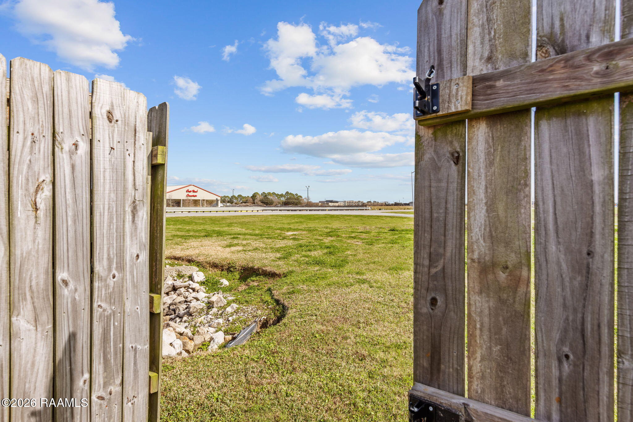 101 Chemet Road Youngsville, LA 70592 - Photo 28 of 29 Double gate access to back yard