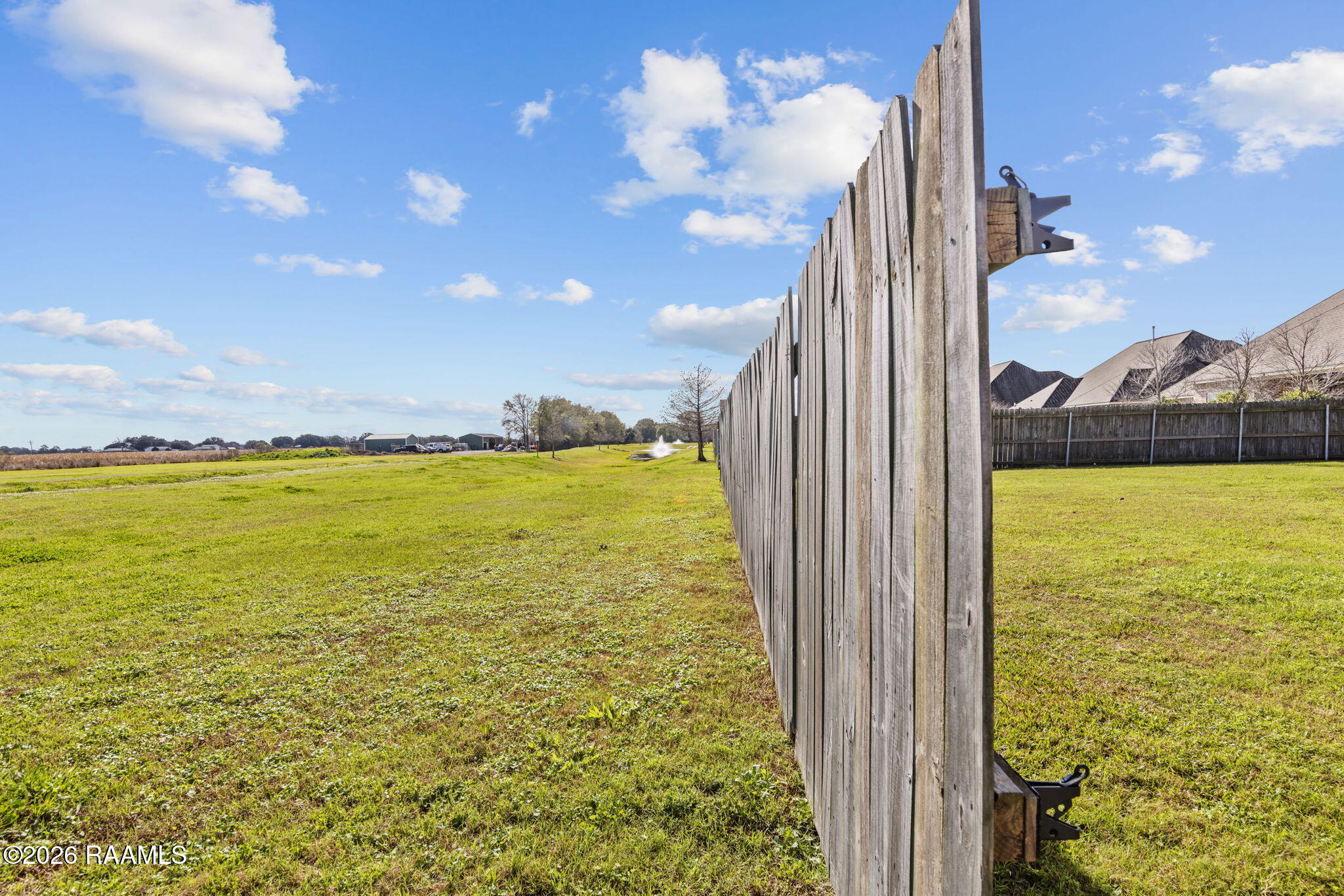 101 Chemet Road Youngsville, LA 70592 - Photo 29 of 29 VIEW from rear gate to ponds