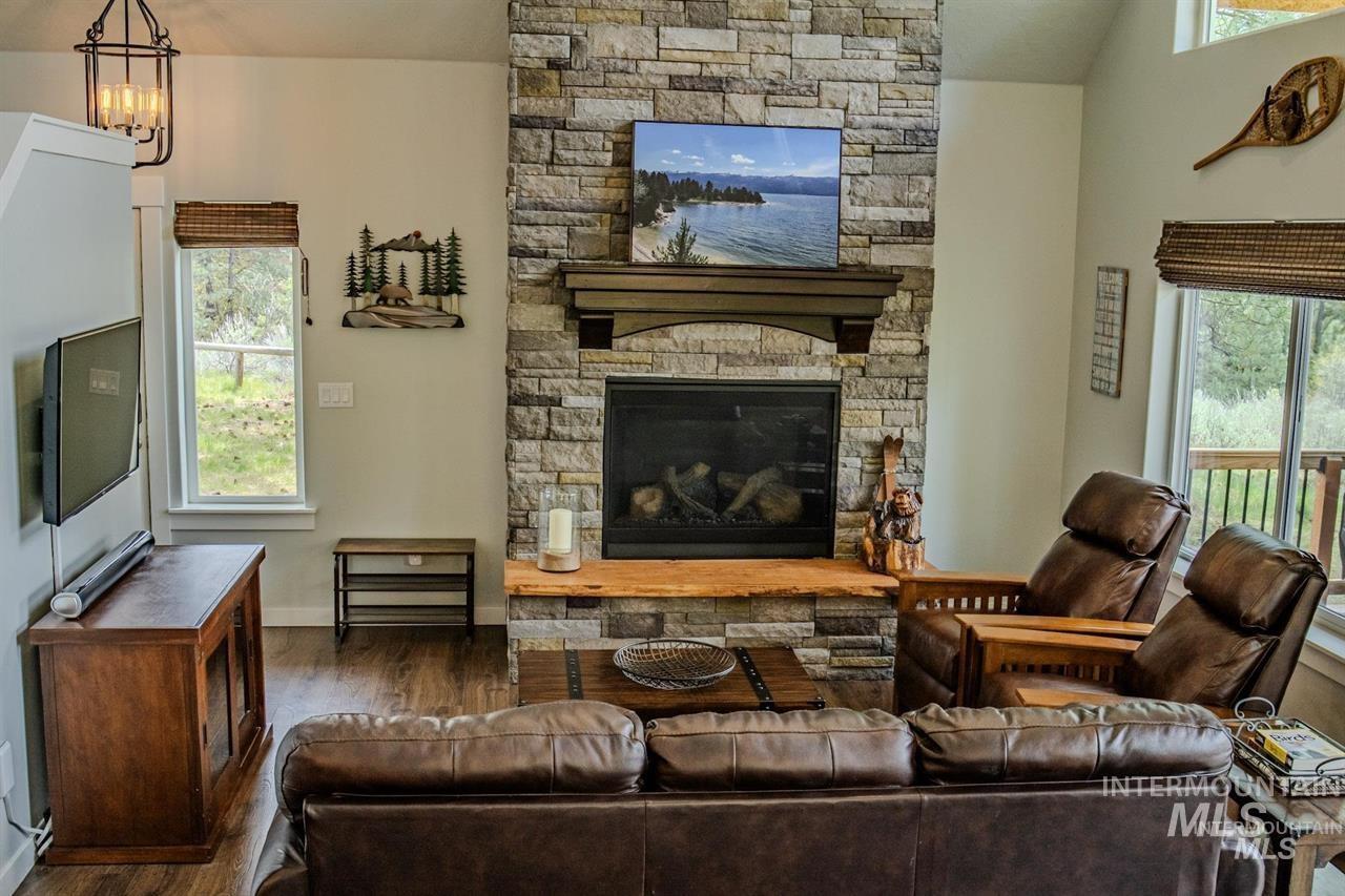 21 Melonie Loop Cascade, ID 83611 - Photo 12 of 27 Stone-clad fireplace featuring a wood mantel and hearth