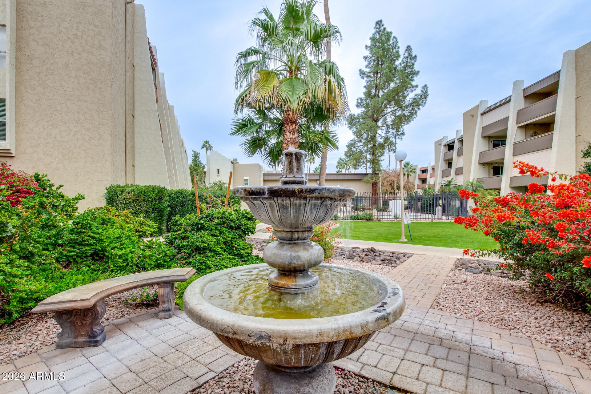 7625 East Camelback Road, Unit A220 Scottsdale, AZ 85251 - Photo 13 of 37 a view of a fountain in the patio with a fountain