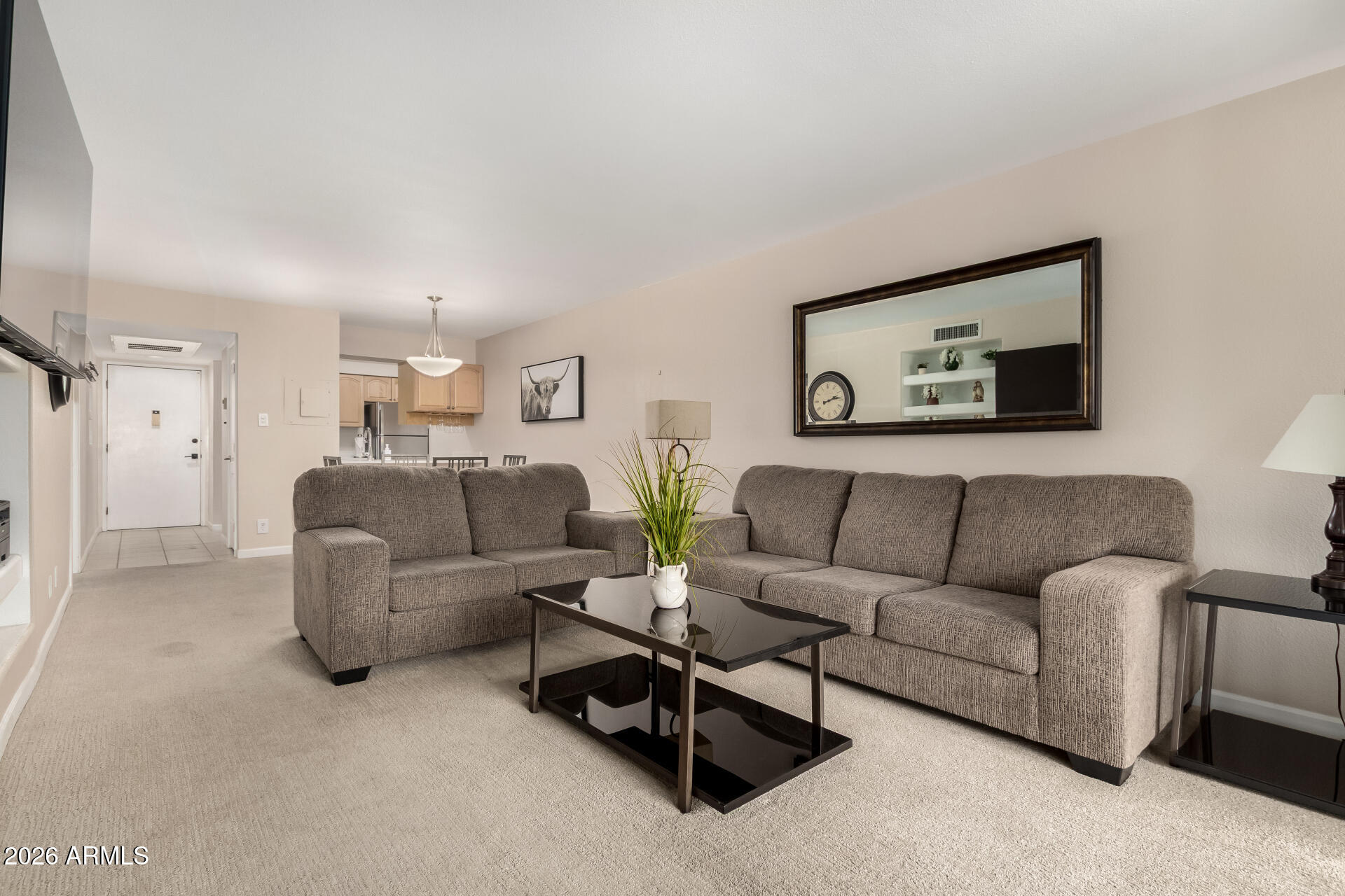 7625 East Camelback Road, Unit A220 Scottsdale, AZ 85251 - Photo 20 of 37 a living room with furniture and a couch