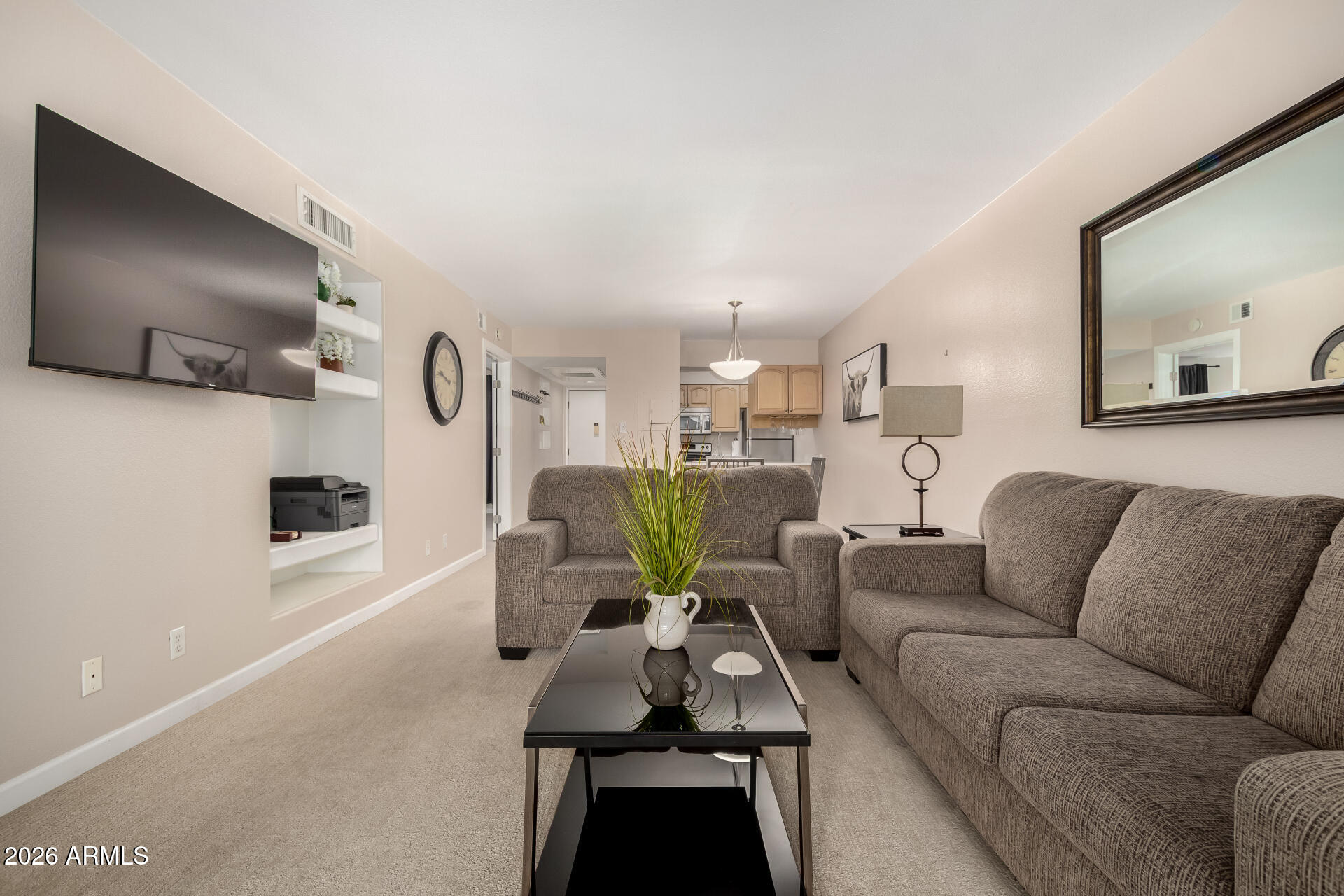 7625 East Camelback Road, Unit A220 Scottsdale, AZ 85251 - Photo 21 of 37 a living room with furniture and a flat screen tv