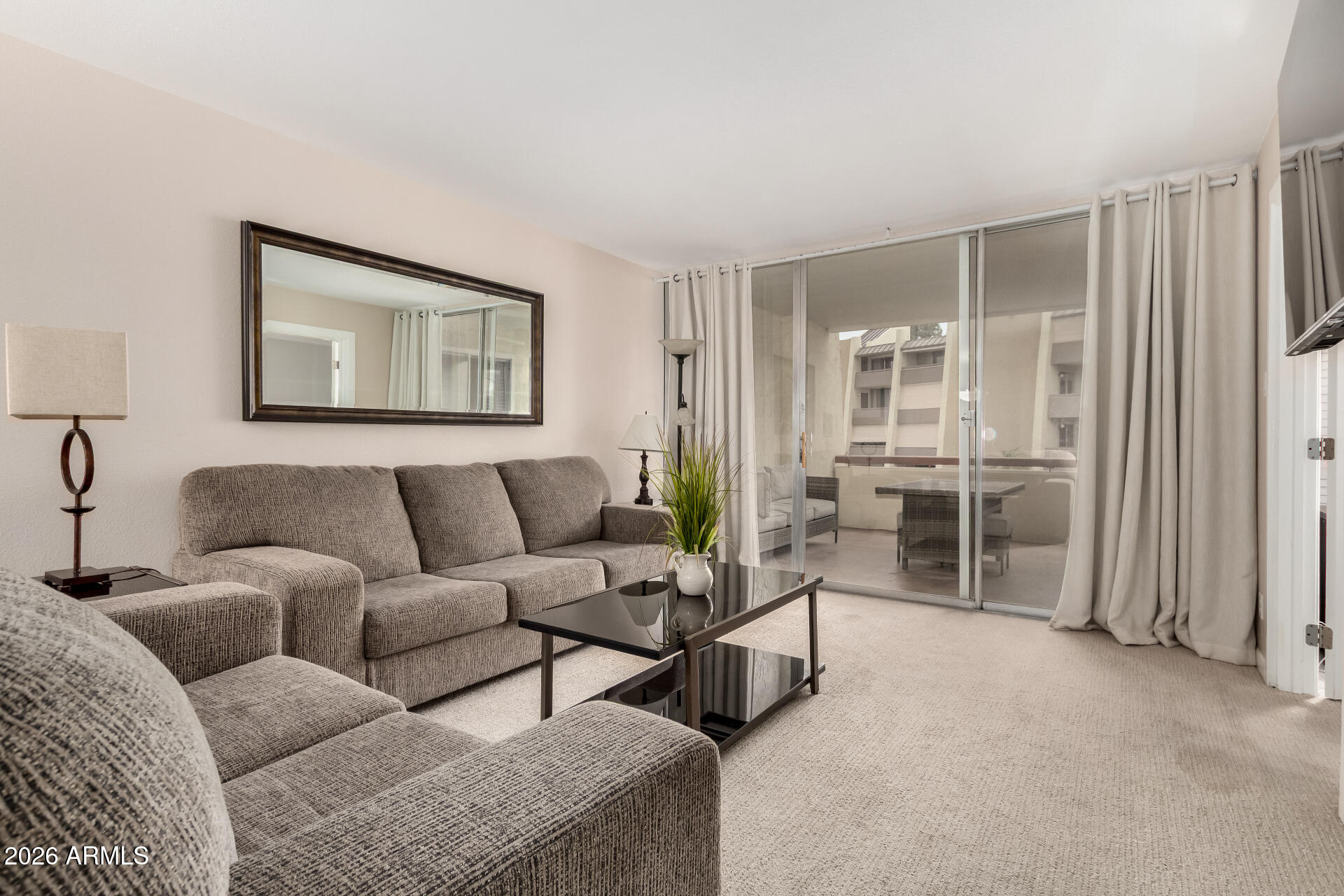 7625 East Camelback Road, Unit A220 Scottsdale, AZ 85251 - Photo 22 of 37 a living room with furniture and a large window