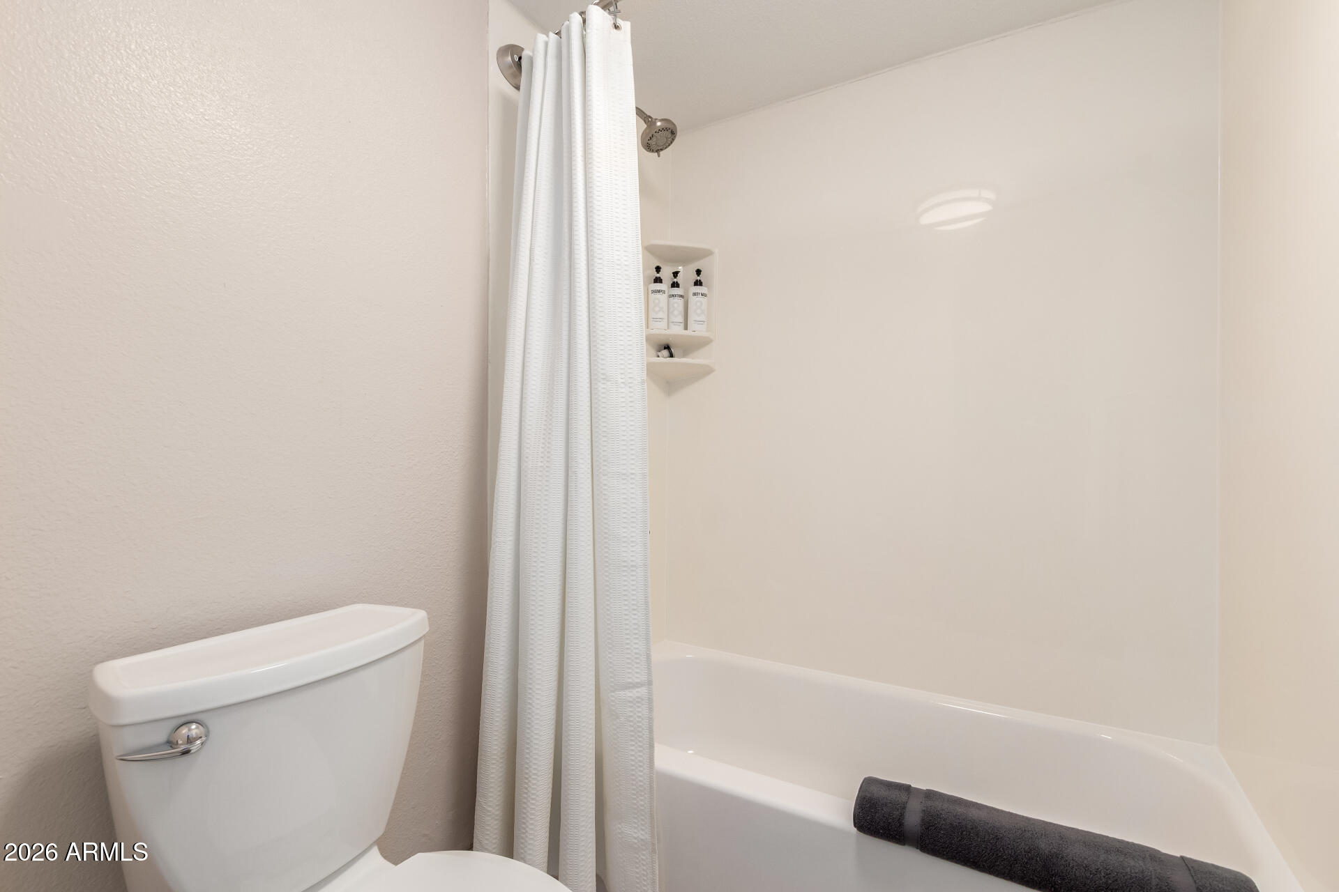 7625 East Camelback Road, Unit A220 Scottsdale, AZ 85251 - Photo 26 of 37 a bathroom with a toilet and a shower
