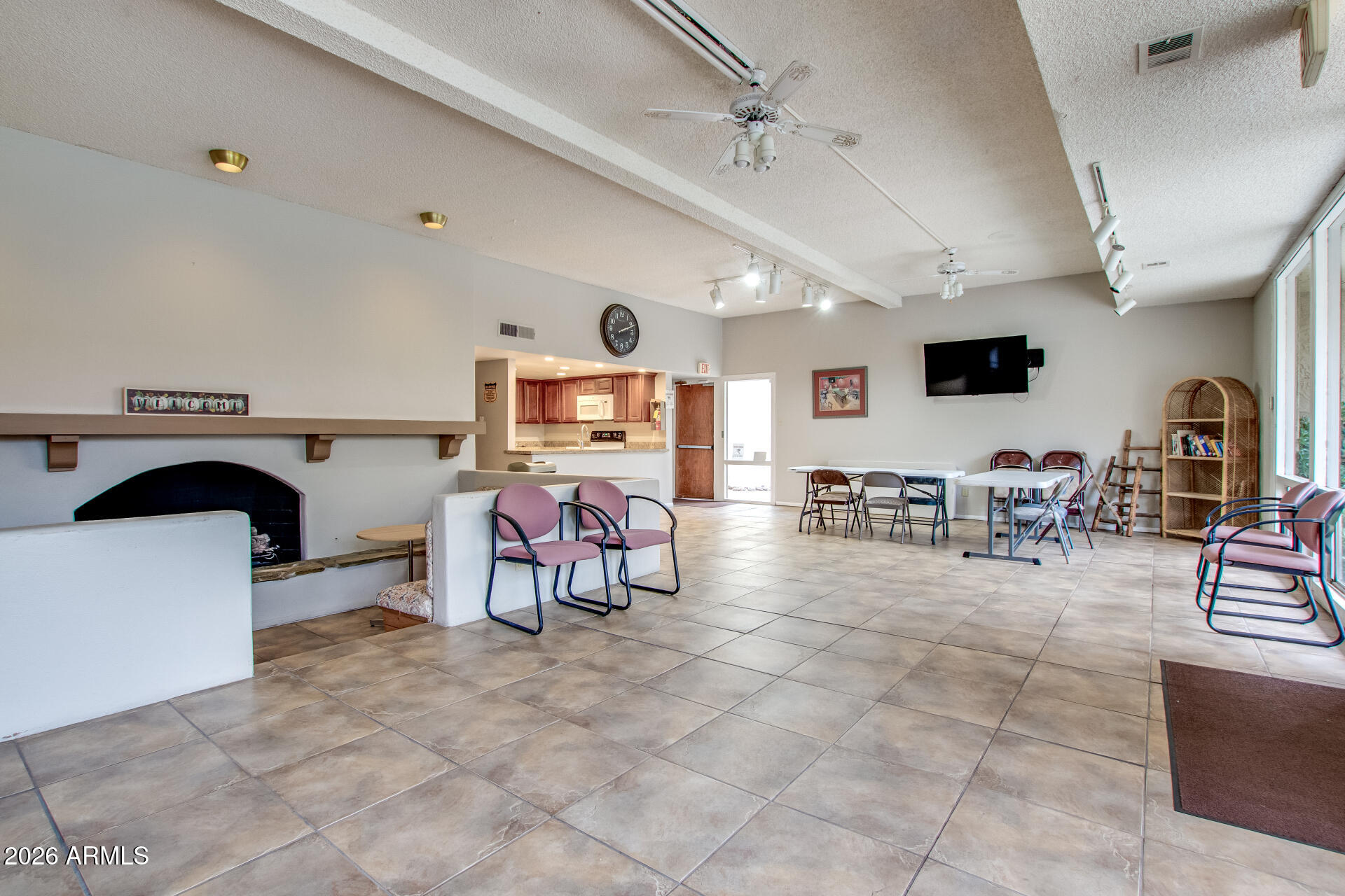 7625 East Camelback Road, Unit A220 Scottsdale, AZ 85251 - Photo 31 of 37 a view of a livingroom with furniture and a flat screen tv