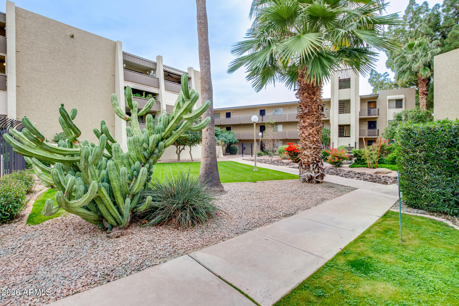 7625 East Camelback Road, Unit A220 Scottsdale, AZ 85251 - Photo 36 of 37 a front view of multiple houses with yard