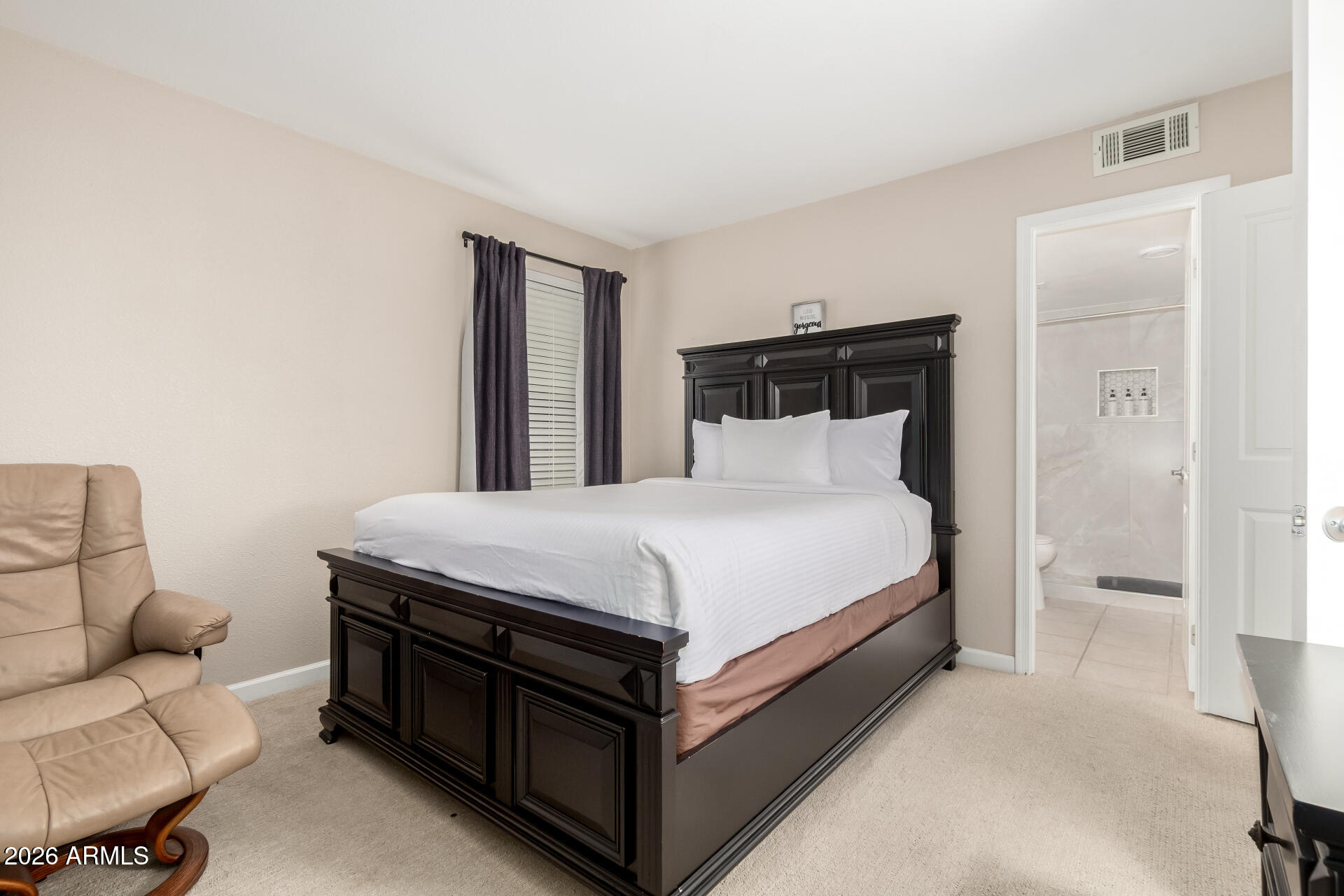 7625 East Camelback Road, Unit A220 Scottsdale, AZ 85251 - Photo 8 of 37 a bedroom with a bed and a couch