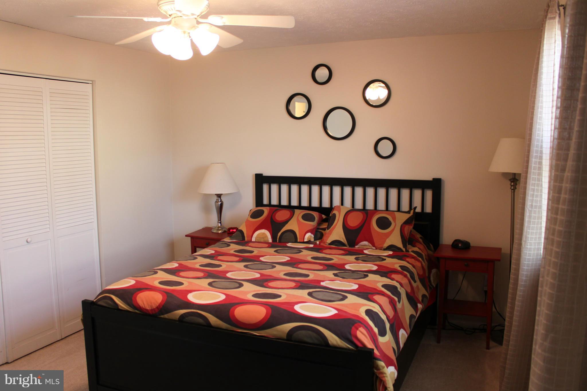 4404 Cub Run Road Chantilly, VA 20151 - Photo 15 of 30 a bedroom with a bed and a table in it