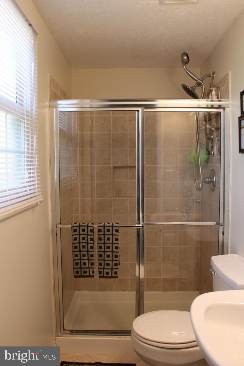 4404 Cub Run Road Chantilly, VA 20151 - Photo 17 of 30 a bathroom with a toilet and a shower